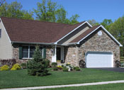 Autumn Builders ranch home with stone front and side-entry garage