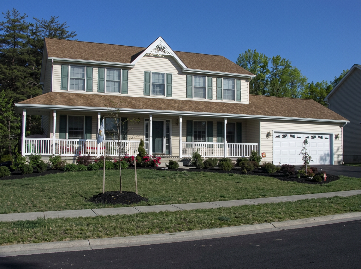 Two-story Autumn Builders home with a full-width covered front porch